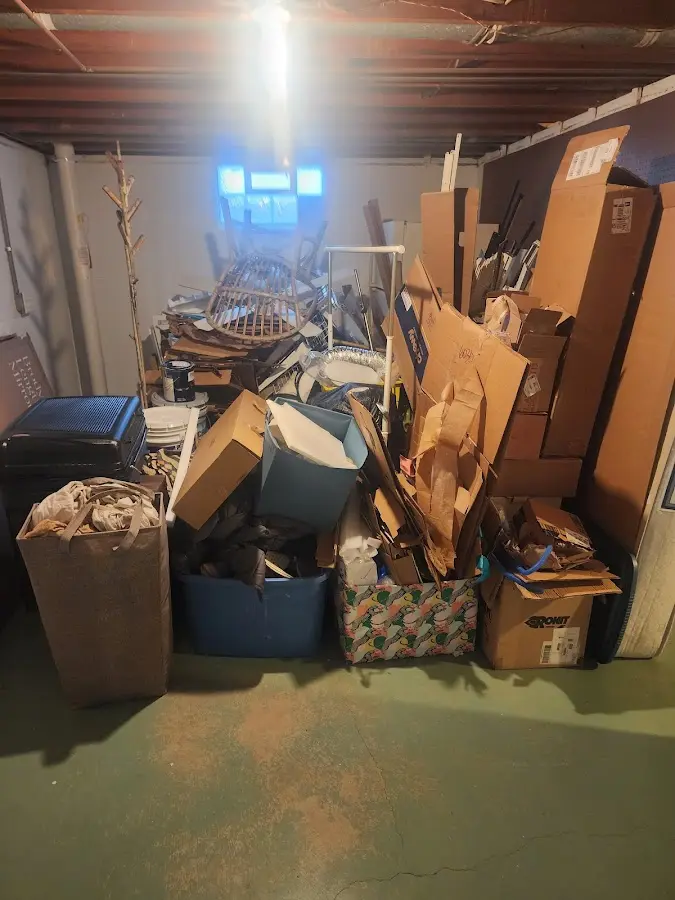 Roll-off dumpster container at job site for 2 Yard Dumpster Rental in Harmony